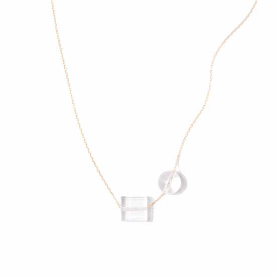 Michelle Starbuck Designs clear crystal quartz square and round beads with thin gold plated brass chain on white background