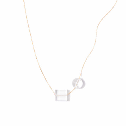 Michelle Starbuck Designs clear crystal quartz square and round beads with thin gold plated brass chain on white background