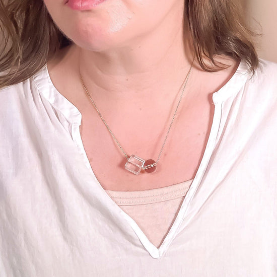 clear crystal quartz bead necklace worn by model with white top