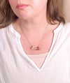 clear crystal quartz bead necklace worn by model with white top