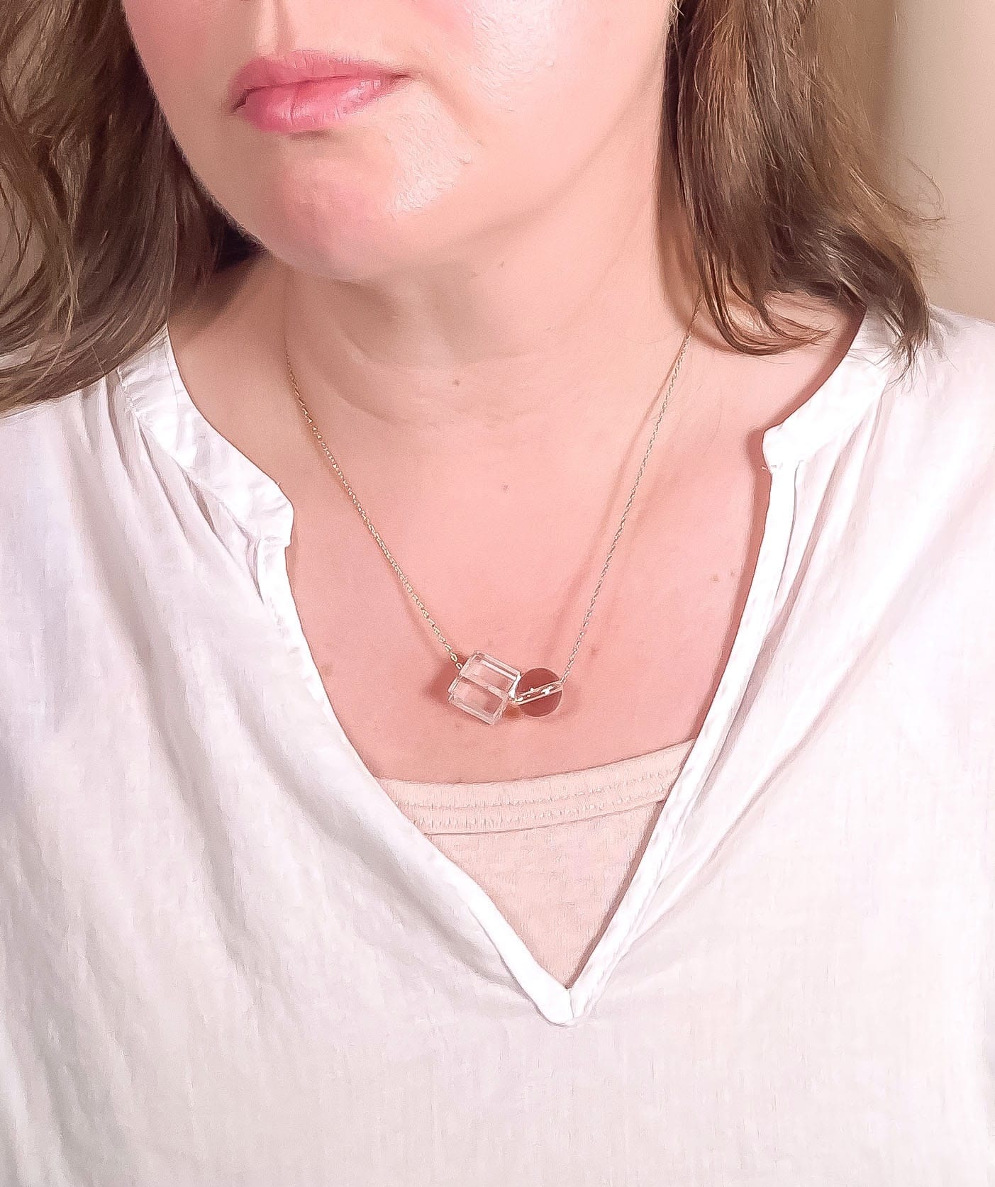 clear crystal quartz bead necklace worn by model with white top